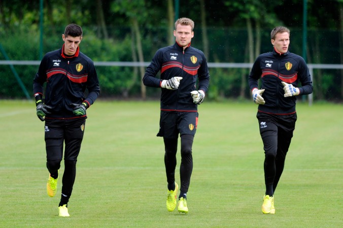 Belgium's Courtois, Mignolet and Bossut run during a training session at the squad's camp ahead of the 2014 World Cup in Knokke-Heist